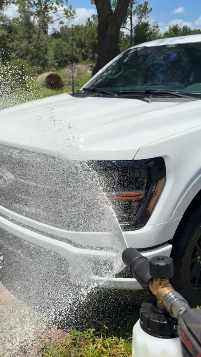 Foam cannon wash on white pickup truck