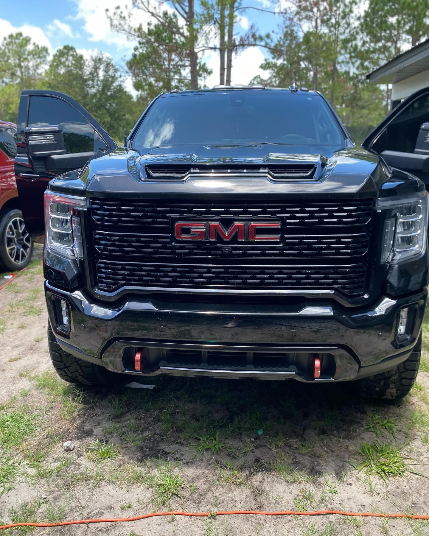 Black GMC Sierra front end with glossy finish