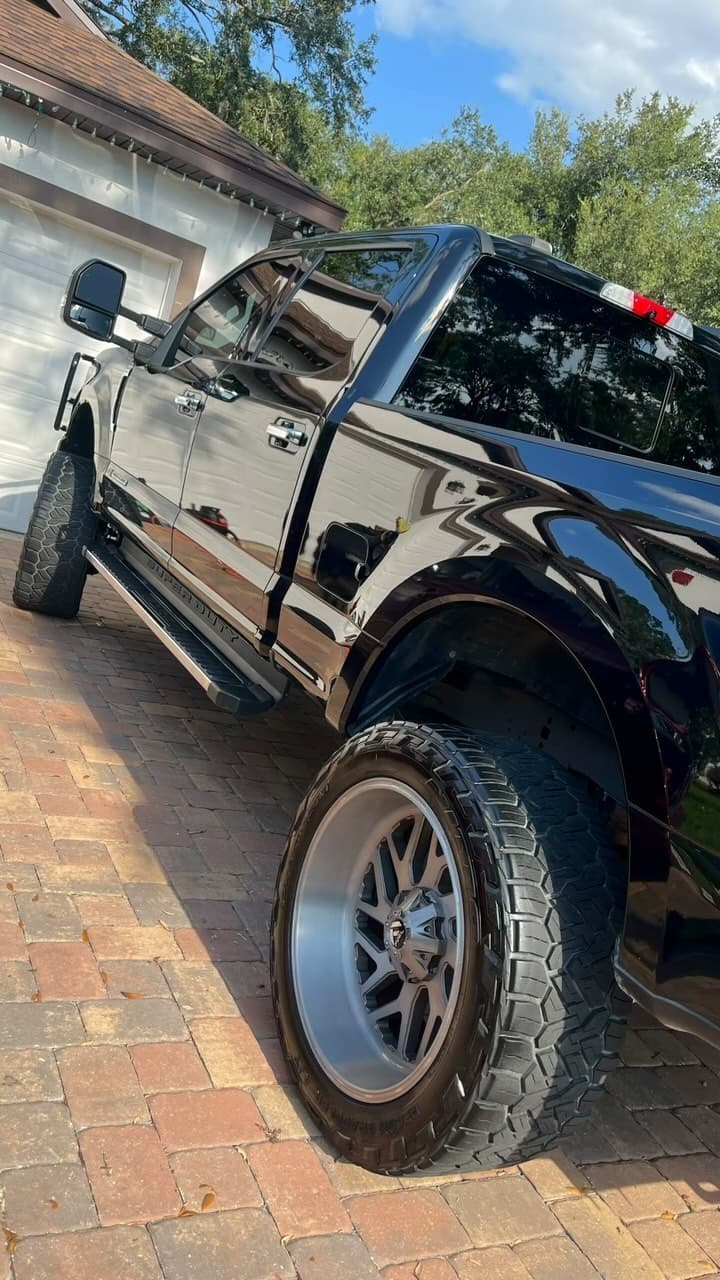 Lifted black Ford Super Duty after exterior detail